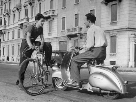 dmitri-kessel-two-men-talking-in-street-with-vespa-scooter-and-bicycle.jpg